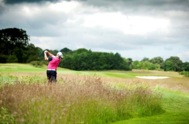 Person playing golf on golf course